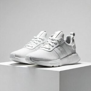 Designer Luxury Sneakers - High-End Pair on White Pedestal with Dramatic Lighting